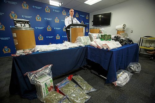 MIKE DEAL / WINNIPEG FREE PRESS
Winnipeg Police Inspector Max Waddell announces that a major inter-provincial drug network was dismantled recently during what they have called Project Gold Dust. During the 10-month long investigation the police were able to confiscate among other things; 17 kilograms of cocaine (which the dealers were calling BitCoin), 21lbs of cannabis, $2million in cash, $107,000 in bit-coin, along with several guns which were on display at the police headquarters during the media conference Wednesday morning.
210224 - Wednesday, February 24, 2021.