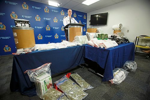MIKE DEAL / WINNIPEG FREE PRESS
Winnipeg Police Inspector Max Waddell announces that a major inter-provincial drug network was dismantled recently during what they have called Project Gold Dust. During the 10-month long investigation the police were able to confiscate among other things; 17 kilograms of cocaine (which the dealers were calling BitCoin), 21lbs of cannabis, $2million in cash, $107,000 in bit-coin, along with several guns which were on display at the police headquarters during the media conference Wednesday morning.
210224 - Wednesday, February 24, 2021.