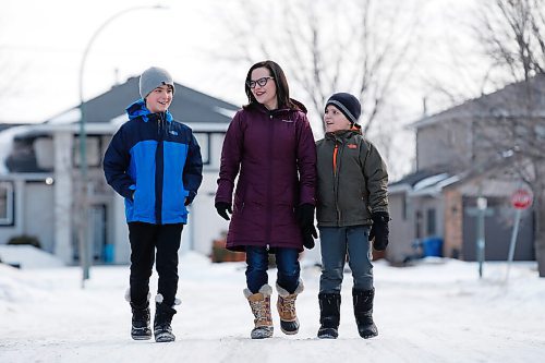 JOHN WOODS / WINNIPEG FREE PRESS
Susan Wingert, a parent and letter writing organizer who is asking the government for more information and data regarding the COVID education dashboard, is photographed with her sons Alec, 10, right, and Alden, 12, in Winnipeg, Wednesday, February 24, 2021. Despite provincial promises parents say they still arent getting the information they need to make the right decisions for their families via the new dashboard. 


Reporter: McIntosh