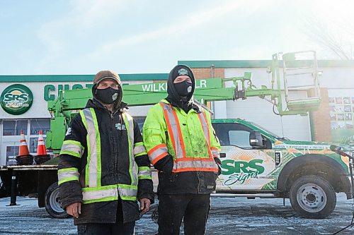 MIKE SUDOMA / WINNIPEG FREE PRESS
(Left to Right) SRS Sign employees, Sergii Koviazn and Vlad Lebedev, talk to media Thursday after using their bucket truck to save a civilian who was hanging they saw hanging from the Disraeli Overpass Wednesday afternoon
February 25, 2021