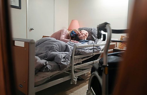 RUTH BONNEVILLE / WINNIPEG FREE PRESS 
 
Local - Vaccine transport of bedridden 

 Linda-Beth Marr sits next to her dad, 95-year-old dad William Marr, as he sleeps in his  bed which is part of a shared living space with Linda and her husband Thursday.    

Story: Linda-Beth Marr has booked a COVID-19 vaccination appointment for her 95-year-old dad, who lives with her in Osborne Village and is bed ridden and very frail, but says it will be a tough day for him when he goes. He will require a stretcher service to transport him to and from the RBC Convention Centre.  The cost of the service is $1,100.00 which is covered by Veteran Services.  She worries about other vulnerable people who are in a similar position but without the same means or coverage.   The province is not going to bring vaccine to homebound folks, which she said is a very bad oversight on the part of government. 

Her father, William Marr, is 95 and turns 96 in June of this year.  He is a retired pharmacist and has become more frail since his wife past last year. 

Danielle Da Silva - Reporter 
Winnipeg Free Press 

Feb 25, 2021
