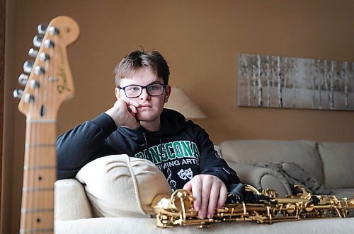 RUTH BONNEVILLE / WINNIPEG FREE PRESS 
 
Local  - High school band program

Reid Hepworth hasn't played his saxophone with a band since last March. At home, virtual concert band classes just aren't the same, he says, adding he has less motivation to practice and students can't play altogether because of lags. Reid in his home with his sax and electric guitar. 

VIRUS BAND STUDENTS: As the province mulls further reopening stages, students, parents and teachers alike are calling for the resumption of indoor band classes. The absence of in-person band has had a significant and detrimental impact on students' sense of belonging and mental health, according to the Manitoba Band Parent Advocacy Group. Meantime, divisions have started to resume some indoor sports and have already purchased supplies of bell covers, etc. to do band safely. Bell covers for brass instruments arrived at Westgate Mennonite Collegiate the day before the province shut down band in October. They have yet to be used, said band teacher Ross Brownlee. Talking to parents, students, band association, province, etc. MAGGIE, 16-18" (with fresh art) 


Maggie  Macintosh
Winnipeg Free Press 

Feb 26, 2021
