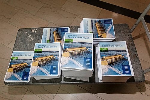 MIKE DEAL / WINNIPEG FREE PRESS
The 14,000 page Hydro Report called the Economic Review of Bipole III Keeyask Report. The document has 6 volumes and weighs in around 140lbs. Only this one copy was printed. 
210226 - Friday, February 26, 2021.