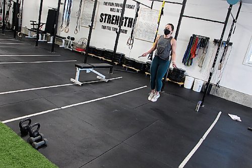 Canstar Community News Kristy Friesen works out at Harvest Health & Fitness on Feb. 25. Friesen is the only client in the gym and keeps her mask on the whole time. (GABRIELLE PICHÉ/CANSTAR COMMUNITY NEWS/HEADLINER)