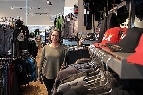 Canstar Community News Tobi Hunter, apparel manager for Headingley Sport Shop, poses near a clothing rack on Feb. 24. The section was closed off earlier this year because it was deemed non-essential. (GABRIELLE PICHÉ/CANSTAR COMMUNITY NEWS/HEADLINER)