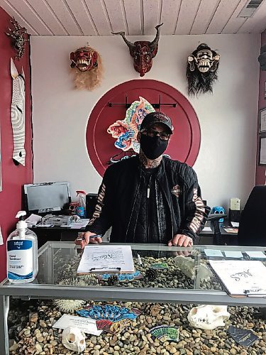 Canstar Community News Mike Wolfe, owner of Art and Soul Tattoo (853 Henderson Hwy.), is happy to be back in business. (SHELDON BIRNIE/CANSTAR/THE HERALD)
