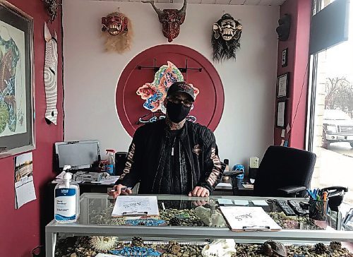 Canstar Community News Mike Wolfe, owner of Art and Soul Tattoo (853 Henderson Hwy.), is happy to be back in business. (SHELDON BIRNIE/CANSTAR/THE HERALD)