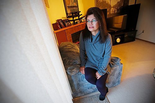 JOHN WOODS / WINNIPEG FREE PRESS
Mely Dela Cruz, a home care aide for fifteen years, is photographed in her home in Winnipeg Monday, March 1, 2021. Provincial COVID-19 race-based data indicates members of the Filipino community are hardest hit by COVID-19. Dela Cruz takes precautions and wears proper PPE while she works.

Reporter: May