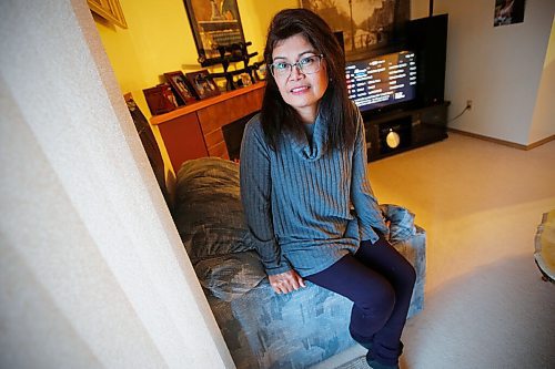 JOHN WOODS / WINNIPEG FREE PRESS
Mely Dela Cruz, a home care aide for fifteen years, is photographed in her home in Winnipeg Monday, March 1, 2021. Provincial COVID-19 race-based data indicates members of the Filipino community are hardest hit by COVID-19. Dela Cruz takes precautions and wears proper PPE while she works.

Reporter: May