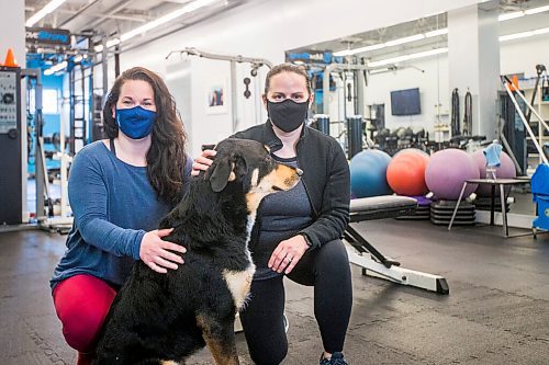 MIKAELA MACKENZIE / WINNIPEG FREE PRESS

Co-owners Chelsea White (left) and Lindsay Jurkowski pose for a portrait with gym dog, Hudson, at Advantage Conditioning in Winnipeg on Tuesday, March 2, 2021. They're happy with the extension, but are struggling with the restrictions. For Temur story.

Winnipeg Free Press 2021