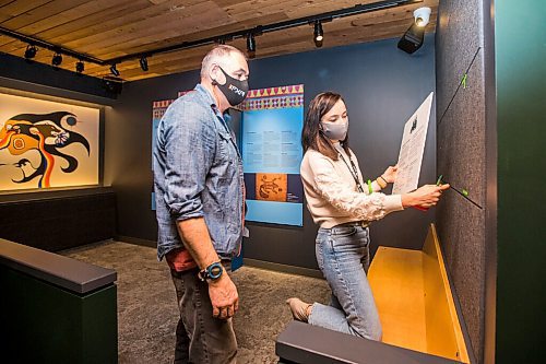 MIKAELA MACKENZIE / WINNIPEG FREE PRESS

Paul Martin, operations technician, and Anastasiia Mavrina, exhibition designer, plan the location of new Indigenous language signs throughout the exhibits at the Manitoba Museum in Winnipeg on Wednesday, March 3, 2021. The museum is re-opening to the public on March 4. Standup.

Winnipeg Free Press 2021