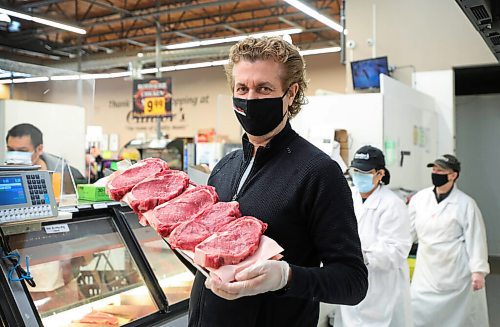 RUTH BONNEVILLE / WINNIPEG FREE PRESS 

Sunday Special - Cantor's Meats & Groceries

Where: Cantor's Meats & Groceries, 1445 Logan Ave.  owner Ed Cantor 

Photo of Ed Cantor with tray of Ribeye steaks.  

What: This is for a two-page Sunday Special on Cantor's, approaching its 80th anniversary in biz; the grocery store continues to evolve, it partnered with Fresh Co. a couple of years ago - the meat dept. in some of the stores is run by Cantors - and they'll be entering a few more Fresh Co. locations this year.
 
Ed's grandfather started the biz in the early 1940s, after emigrating to Canada from Poland; he died young, a few years into the business, and his two son's, Ed's dad and uncle took over - both working there into until the day they died, literally. 

Ed, 56, has no plans to retire - he's hoping to be welcoming customers at least until the store turns 100, in 2042. 

For Sunday March 7 

March 02, 2021

