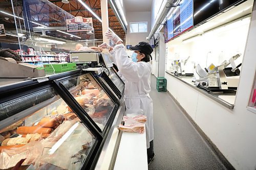 RUTH BONNEVILLE / WINNIPEG FREE PRESS 

Sunday Special - Cantor's Meats & Groceries

Where: Cantor's Meats & Groceries, 1445 Logan Ave.  owner Ed Cantor 
Photo of meat counter staff, Emma,  packaging meat orders from customers,  
What: This is for a two-page Sunday Special on Cantor's, approaching its 80th anniversary in biz; the grocery store continues to evolve, it partnered with Fresh Co. a couple of years ago - the meat dept. in some of the stores is run by Cantors - and they'll be entering a few more Fresh Co. locations this year.
 
Ed's grandfather started the biz in the early 1940s, after emigrating to Canada from Poland; he died young, a few years into the business, and his two son's, Ed's dad and uncle took over - both working there into until the day they died, literally. 

Ed, 56, has no plans to retire - he's hoping to be welcoming customers at least until the store turns 100, in 2042. 

For Sunday March 7 

March 02, 2021
