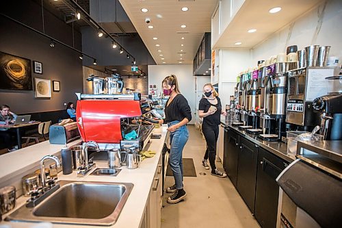 MIKAELA MACKENZIE / WINNIPEG FREE PRESS

Summer Catcheway (left) and Annalise Neufeld work at Good Earth Coffeehouse on Sterling Lyon Parkway in Winnipeg on Wednesday, March 3, 2021. For Temur story.

Winnipeg Free Press 2021