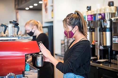 MIKAELA MACKENZIE / WINNIPEG FREE PRESS

Summer Catcheway makes a latte at Good Earth Coffeehouse on Sterling Lyon Parkway in Winnipeg on Wednesday, March 3, 2021. For Temur story.

Winnipeg Free Press 2021