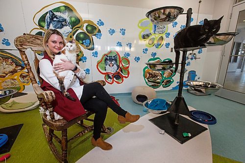 MIKE DEAL / WINNIPEG FREE PRESS
Jessica Miller, CEO of Winnipeg Humane Society, holds Cali while Damien takes a higher perch in the cat room at 45 Hurst Way.
See Doug Speirs story
210304 - Thursday, March 04, 2021.