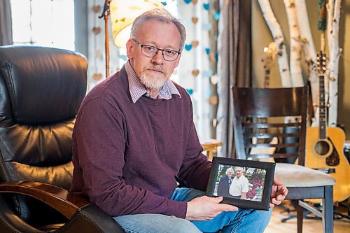 MIKAELA MACKENZIE / WINNIPEG FREE PRESS

Jim Friesen, son of Elisabeth Friesen (who died of COVID-19 at the Rest Haven Nursing Home in November), poses for a portrait with a photo of his mother in Winnipeg on Thursday, March 4, 2021. For Kevin story.

Winnipeg Free Press 2021