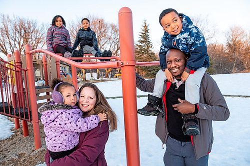 Daniel Crump / Winnipeg Free Press. Sophie Freyet-Agossa and her partner Wilgis Agossa with their four children, Emmanuel Agossa (9), Marie-Rose Agossa (7), Mathéo Agossa (5), Ophélia Agossa (2) in the park across from their St. Boniface home. February 27, 2021.