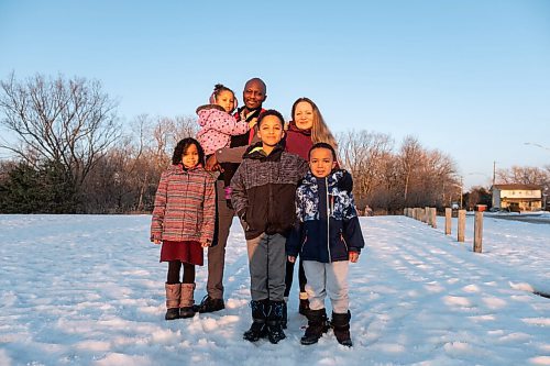 Daniel Crump / Winnipeg Free Press. Sophie Freyet-Agossa and her partner Wilgis Agossa with their four children, Emmanuel Agossa (9), Marie-Rose Agossa (7), Mathéo Agossa (5), Ophélia Agossa (2) in the park across from their St. Boniface home. February 27, 2021.