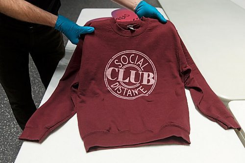 MIKE DEAL / WINNIPEG FREE PRESS
Manitoba Museum curator, Roland Sawatzky, has put out a call for artifacts from the COVID-19 pandemic.
A first time mom donated a sweater she wore while isolating at home. The sweater was printed in Manitoba and says, Social Distance Club.
See Jen Zoratti story
210305 - Friday, March 05, 2021.