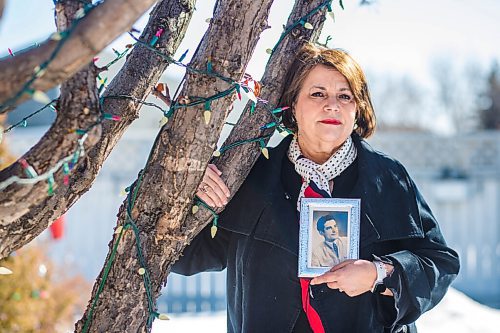 MIKAELA MACKENZIE / WINNIPEG FREE PRESS

Eddie Calisto-Tavares (daughter of Manuel dos Santos de Sousa, who died of COVID-19 in the Maples care home) poses for a portrait beside the apple tree her father planted 29 years ago in her backyard in Winnipeg on Friday, March 5, 2021. For Kevin story.

Winnipeg Free Press 2021