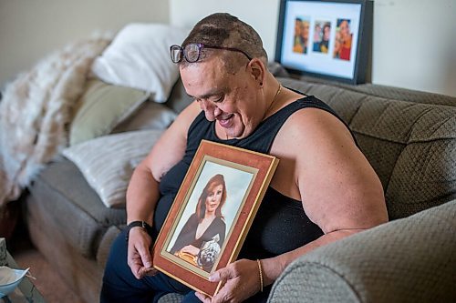 MIKAELA MACKENZIE / WINNIPEG FREE PRESS

Chet Breau (son of Valerie St.Germain, who died of COVID-19) poses for a portrait with a photo of his mother in Winnipeg on Friday, March 5, 2021. For Kevin story.

Winnipeg Free Press 2021