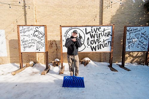 MIKE SUDOMA / WINNIPEG FREE PRESS 
Jamie Hilland an owner of the Ruby West coffee shop on Westminster, cleans snow off of the spot where the cafés temporary patio had sat last year.
March 5, 2021