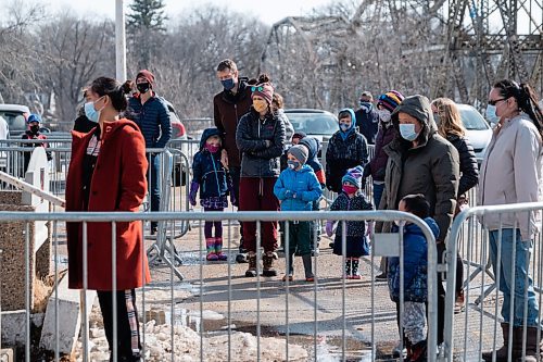 Daniel Crump / Winnipeg Free Press. Andrew and Jolene Hedlin wait in line to get ice cream from the Bridge Drive-In with their kids, and niece and nephew, as the famed ice cream spot opens for the season. The line for March 6, 2021.