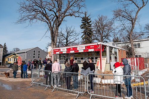 Daniel Crump / Winnipeg Free Press. Dozens of people lined up before 2pm on Saturday waiting for the Bridge Drive-In, better known just as BDI, to open for the season. The line continued to grow as the ice cream began to flow. March 6, 2021.