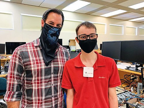 Canstar Community News Frank Catojo, teacher of the information systems program at the Arts and Technical Centre is pictured with former student Noah Reeder, who is now studying at Royal Military College in Kingston, Ont.
