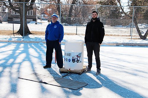 Canstar Community News Cam Scott, left, and Brady Moxham stand beside the Zam-Bobby, a creation by Scott's father-in-law to flood the school's ice rinks. (GABRIELLE PICHÉ/CANSTAR COMMUNITY NEWS/HEADLINER)