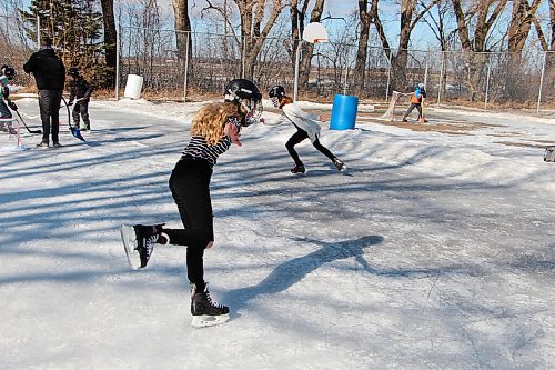 Canstar Community News Kora Montour, left, and Casey Moffit skate around during a lunch break at Oakville School on March 2. The girls said they like to practise figure skating. (GABRIELLE PICHÉ/CANSTAR COMMUNITY NEWS/HEADLINER)