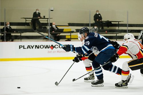 JOHN WOODS / WINNIPEG FREE PRESS
Manitoba Moose David Gustafsson (19) breaks through  Stockton Heats Colton Poolman (5) and Alexander Yelesin (45) during first period AHL action in Winnipeg on Monday, March 8, 2021.

Reporter: Allen