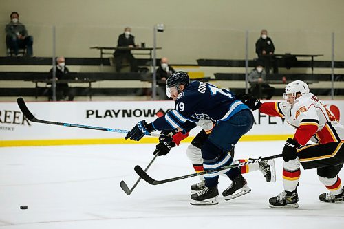 JOHN WOODS / WINNIPEG FREE PRESS
Manitoba Moose David Gustafsson (19) breaks through  Stockton Heats Colton Poolman (5) and Alexander Yelesin (45) during first period AHL action in Winnipeg on Monday, March 8, 2021.

Reporter: Allen