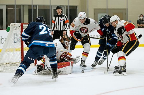 JOHN WOODS / WINNIPEG FREE PRESS
Manitoba Moose Nathan Todd (29) and Jeff Malott (39) try to get the puck past Stockton Heats goaltender Artyom Zagidulin (50) during first period AHL action in Winnipeg on Monday, March 8, 2021.

Reporter: Allen