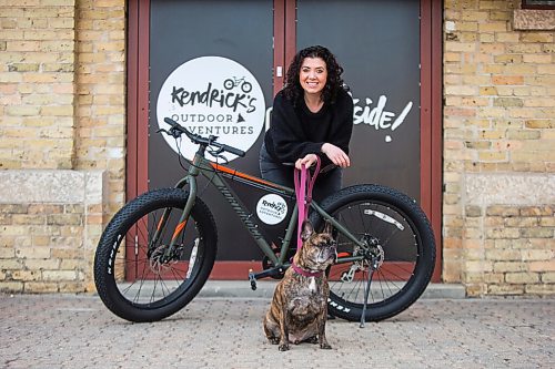 MIKAELA MACKENZIE / WINNIPEG FREE PRESS

Lana Bakun, owner of Kendrick's Outdoor Adventures, and her dog, Kendrick, pose for a photo in front of the outdoor equipment rental company at The Forks in Winnipeg on Wednesday, March 10, 2021. For Sabrina story.

Winnipeg Free Press 2021