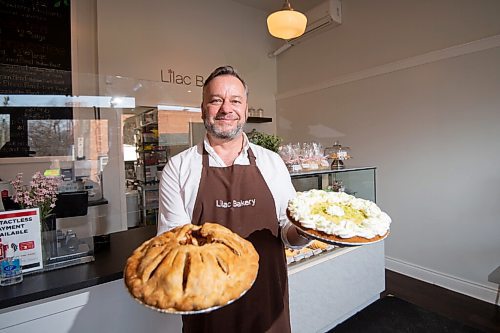 MIKE SUDOMA / WINNIPEG FREE PRESS
Christopher Atkinson of  Lilac Bakery, holds up two of the bakerys most popular pies, Apple, and Key lime.
March 10, 2021