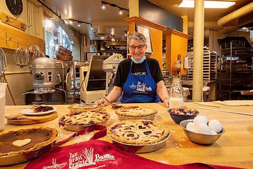 MIKE SUDOMA / WINNIPEG FREE PRESS
Tabitha Langel, an owner at Tall Grass Prairie bakery, shows off a table full of their signature pies Wednesday morning
March 10, 2021