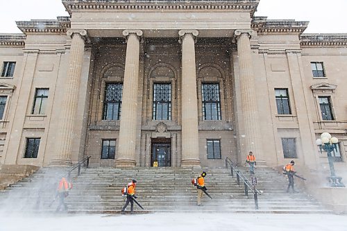 MIKE DEAL / WINNIPEG FREE PRESS
A crew armed with leaf blowers deals with the layer of snow that accumulated on the stairs of the Manitoba Legislative building Thursday morning. 
210311 - Thursday, March 11, 2021.