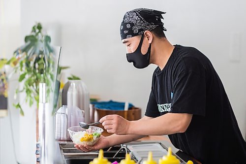 MIKAELA MACKENZIE / WINNIPEG FREE PRESS

Zhehong Wen, owner of Poke Mono, puts together a poke bowl order at his restaurant (which opened on the eve of the pandemic shutdown) in Winnipeg on Thursday, March 11, 2021. For Ben Waldman story.

Winnipeg Free Press 2021