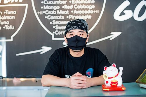 MIKAELA MACKENZIE / WINNIPEG FREE PRESS

Zhehong Wen, owner of Poke Mono, poses for a portrait at his restaurant (which opened on the eve of the pandemic shutdown) in Winnipeg on Thursday, March 11, 2021. For Ben Waldman story.

Winnipeg Free Press 2021