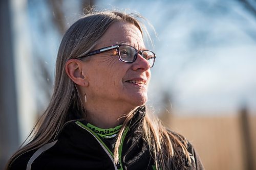 MIKAELA MACKENZIE / WINNIPEG FREE PRESS

Manitoba Runners Association (MRA) executive director Kathy Wiens poses for a portrait on the road outside of her home in Winnipeg on Thursday, March 11, 2021. For Taylor Allen story.

Winnipeg Free Press 2021
