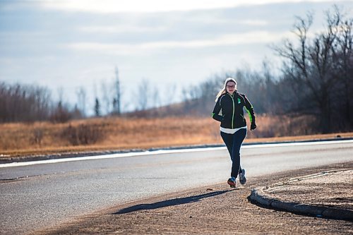 MIKAELA MACKENZIE / WINNIPEG FREE PRESS

Manitoba Runners Association (MRA) executive director Kathy Wiens poses for a portrait on the road outside of her home in Winnipeg on Thursday, March 11, 2021. For Taylor Allen story.

Winnipeg Free Press 2021