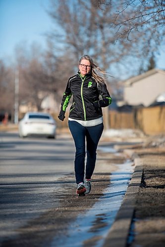 MIKAELA MACKENZIE / WINNIPEG FREE PRESS

Manitoba Runners Association (MRA) executive director Kathy Wiens poses for a portrait on the road outside of her home in Winnipeg on Thursday, March 11, 2021. For Taylor Allen story.

Winnipeg Free Press 2021