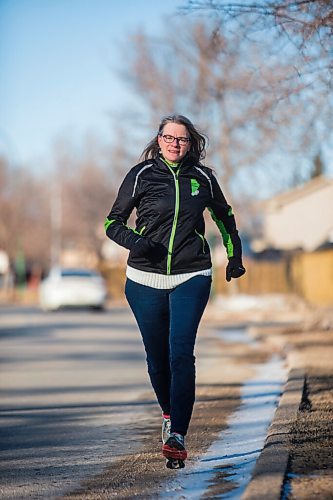 MIKAELA MACKENZIE / WINNIPEG FREE PRESS

Manitoba Runners Association (MRA) executive director Kathy Wiens poses for a portrait on the road outside of her home in Winnipeg on Thursday, March 11, 2021. For Taylor Allen story.

Winnipeg Free Press 2021