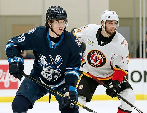 JOHN WOODS / WINNIPEG FREE PRESS
Manitoba Moose Jeff Malott (39) against the Stockton Heat  during first period AHL action in Winnipeg on Thursday, March 11, 2021.

Reporter: Allen