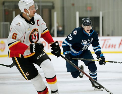 JOHN WOODS / WINNIPEG FREE PRESS
Manitoba Moose Jeff Malott (39) against the Stockton Heat  during first period AHL action in Winnipeg on Thursday, March 11, 2021.

Reporter: Allen