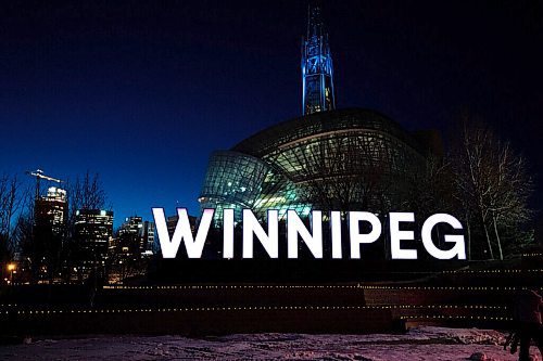 MIKE SUDOMA / WINNIPEG FREE PRESS
Hundreds of tea lights line the ledges in front of the Winnipeg sign at Scotia Bank Stage to commemorate the lives lost during the first year of the Covid 19 pandemic. The top of the Canada Museum for Human Rights tower will be lit up blue in tribute to the health care workers who have been on the frontlines of the pandemic. The memorial will be on display form March 11-14.
March 10, 2021