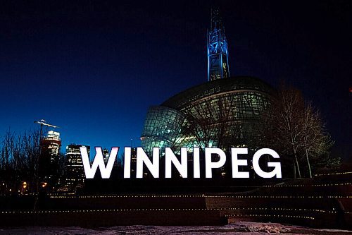 MIKE SUDOMA / WINNIPEG FREE PRESS
Hundreds of tea lights line the ledges in front of the Winnipeg sign at Scotia Bank Stage to commemorate the lives lost during the first year of the Covid 19 pandemic. The top of the Canada Museum for Human Rights tower will be lit up blue in tribute to the health care workers who have been on the frontlines of the pandemic. The memorial will be on display form March 11-14.
March 10, 2021