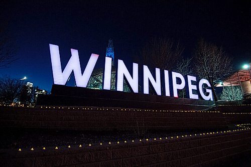 MIKE SUDOMA / WINNIPEG FREE PRESS
Hundreds of tea lights line the ledges in front of the Winnipeg sign at Scotia Bank Stage to commemorate the lives lost during the first year of the Covid 19 pandemic. The top of the Canada Museum for Human Rights tower will be lit up blue in tribute to the health care workers who have been on the frontlines of the pandemic. The memorial will be on display form March 11-14.
March 10, 2021